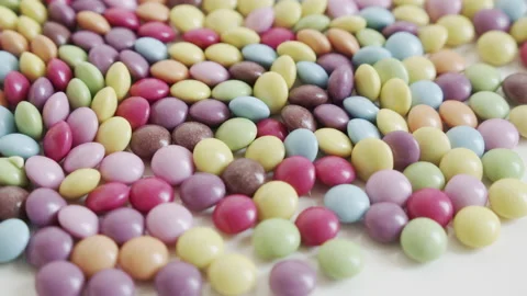 Button shaped candies in many colors 4K close-up video Video stock 153499176