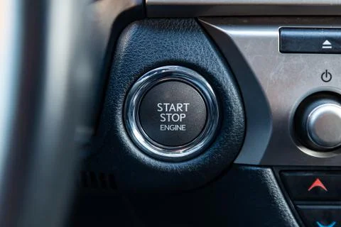 Button start and turn off the ignition of the car engine close-up on the dash Foto stock