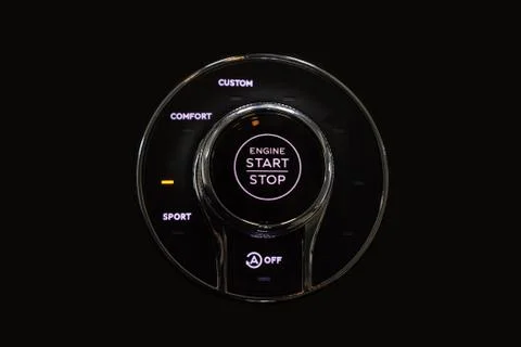 Button start and turn off the ignition of the car engine close-up on the dash Stock Photos