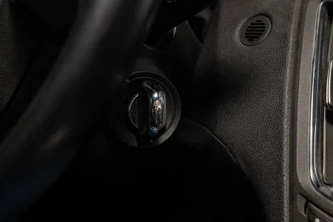 Button start and turn off the ignition of the car engine close-up on the dash 스톡 사진