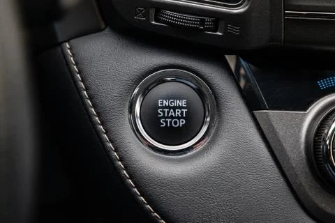 Button start and turn off the ignition of the car engine close-up on the dash 스톡 사진