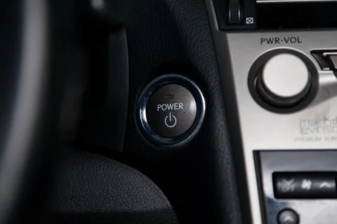 Button start and turn off the ignition of the car engine close-up on the dash Stock Photos