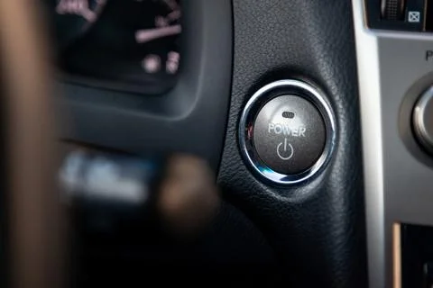 Button start and turn off the ignition of the car engine close-up on the dash 스톡 사진