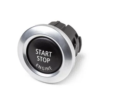 Button start and turn off the ignition of the car engine close-up on the dash Foto stock