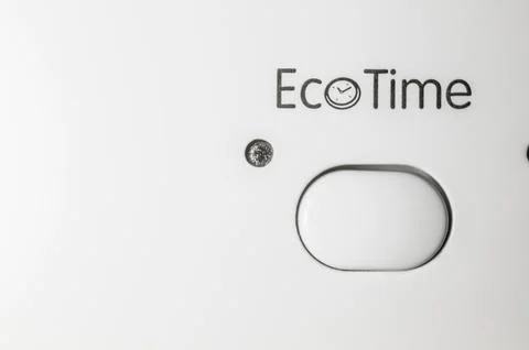 Button to turn on Eco Time mode. Control panel of the washing machine. The Stock Photos