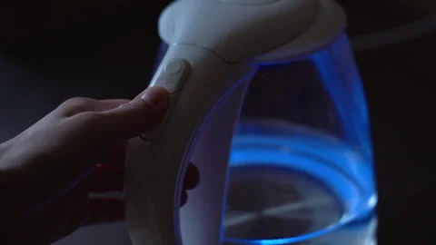 Button for turning on the electric kettle for boiling water. Close-up Stock Footage 256203511