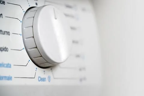 Button of a washing machine with modes closeup. Stock Photos