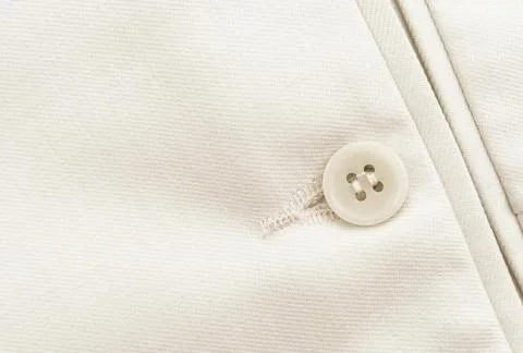 Button on white clothes. Element of men's clothing. Trousers Stock Photos
