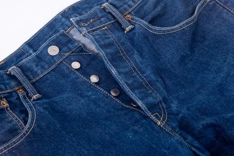 Button width. Levi Strauss blue denim jeans. Stock Photos