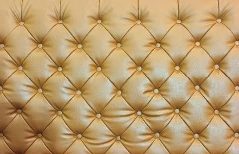 Buttoned on the brown texture. repeat pattern 스톡 사진