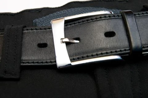 Buttoned strap on black jeans Stock Photos