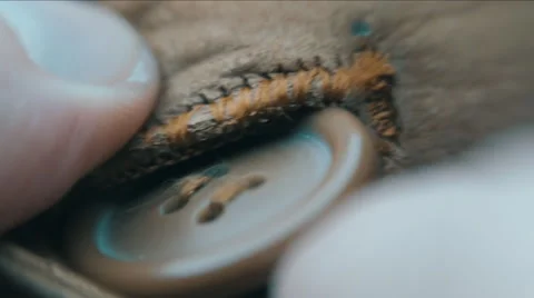 Buttoning on clothes. Macro Stock Footage 59796184