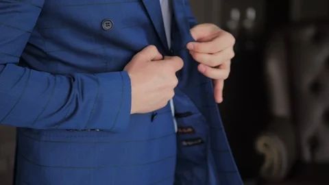 Buttoning a jacket Stock Footage 119533604