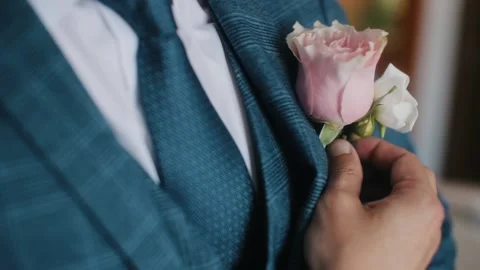 Buttoning a jacket hands close up. Stylish man in suit fastens buttons and Stock Footage 130599251