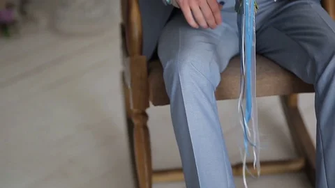 Buttoning a jacket. Stylish man in a suit fastening buttons on his jacket Stock Footage 83222974