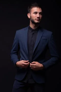 Buttoning jacket, young elegant man Foto stock