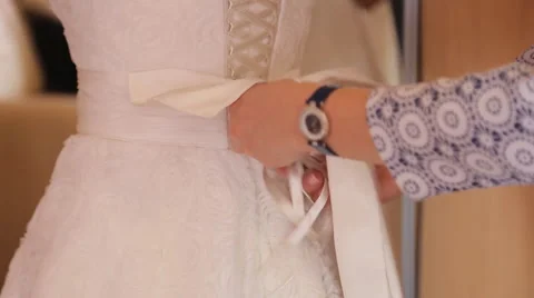 Buttoning The Wedding Dress Stock Footage 61446507