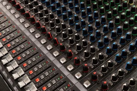 Buttons and knobs to adjust a mixer Foto stock