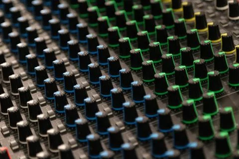 Buttons and knobs to adjust a mixer Foto stock