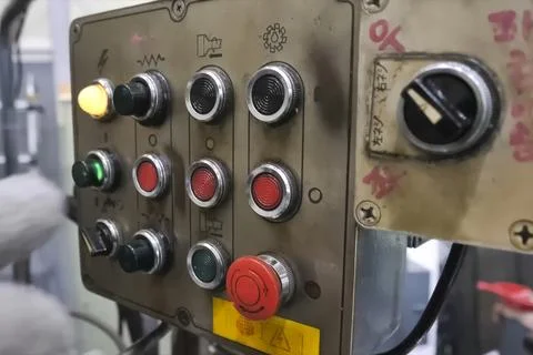 Buttons and switches on the control panel of the machine elements, the hand i Stock Photos