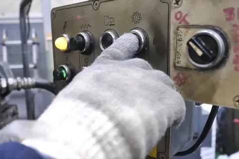 Buttons and switches on the control panel of the machine elements, the hand i Stock Photos