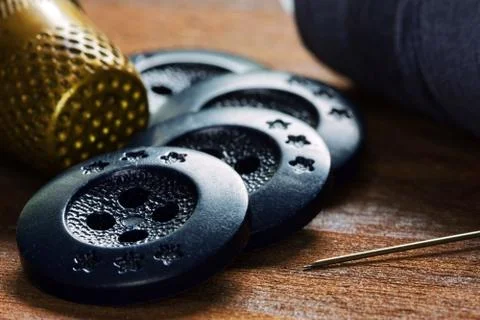 Buttons and thimble close up soft focus Foto stock