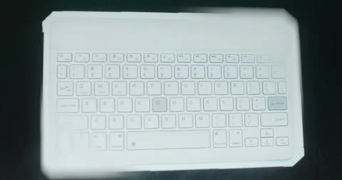 The buttons are pressed on a wireless Bluetooth keyboard Stock Footage 313492971