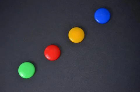 Buttons on the black table. Stock Photos