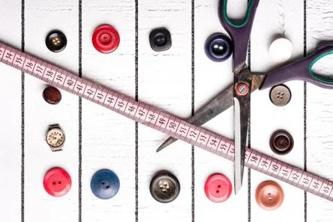 Buttons, centimeter, scissors. Set for cutting and creating clothes Stock Photos