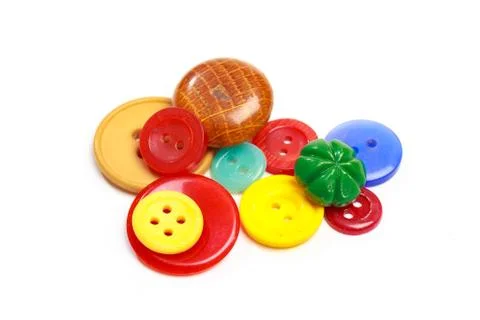 Buttons for clothes on white background using for concept of Button Day. Stock Photos