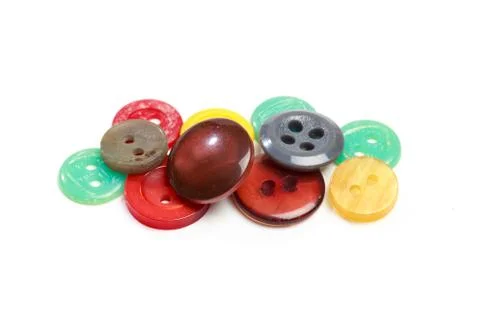 Buttons for clothes on white background using for concept of Button Day. Stock Photos