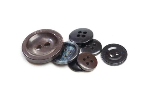 Buttons for clothes on white background using for concept of Button Day. Stock Photos