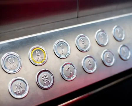 Buttons in the elevator with Braille code for blind people 写真素材