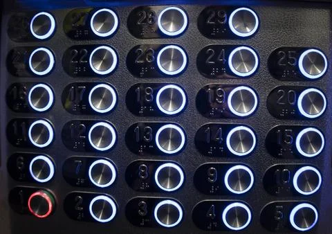 Buttons from the elevator in a high-rise building, metal blue buttons. 스톡 사진