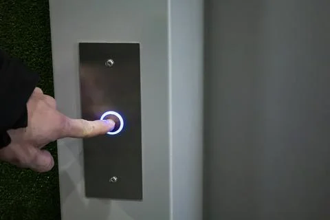 Buttons from the elevator in a high-rise building, metal blue buttons. 스톡 사진