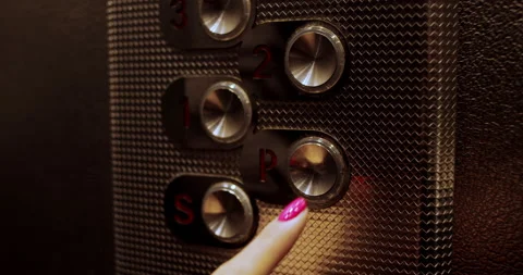 Buttons with floors in the elevator pressed with a woman's finger. Slow motion. Stock Footage 145898707