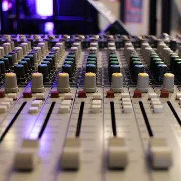 Buttons, knobs and faders of a mixing console in a recording studio. Foto stock