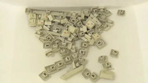 Buttons of an old computer keyboard in the sink. Stock Footage 198410355