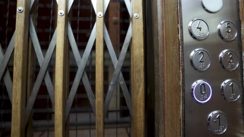Buttons of an old elevator as the lift goes down to the lower floor. POV Video stock 156442309