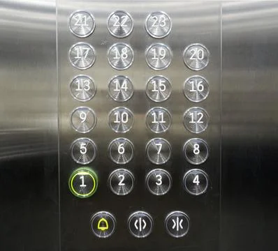 Buttons panel in steel elevator, metal lift, modern 23 level building. Stock Photos