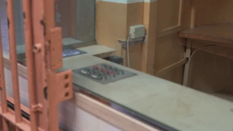 Buttons for remotely opening doors in prison on the background of a metal bars Stockbeeldmateriaal 120091844