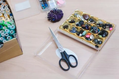 Buttons, scissors, needles and thread Stock Photos