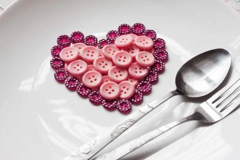 Buttons in shape of heart Foto stock