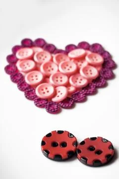 Buttons in shape of heart Foto stock