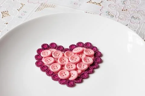 Buttons in shape of heart Foto stock
