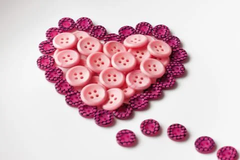 Buttons in shape of heart Foto stock
