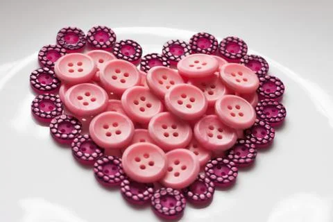 Buttons in shape of heart Foto stock