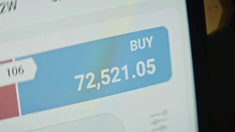 Buy button with Bitcoin price on a crypto trading platform on smartphone Stock Footage 291452074