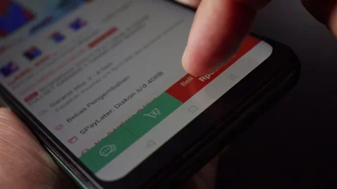 Buy now button on smartphone screen orange Order Confirmed Stock Footage 293999154