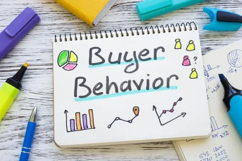 Buyer behavior concept. Open notepad with charts. Stock Photos